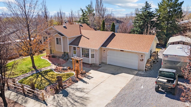 view of front of property featuring brick siding, a garage, concrete driveway, and a shingled roof