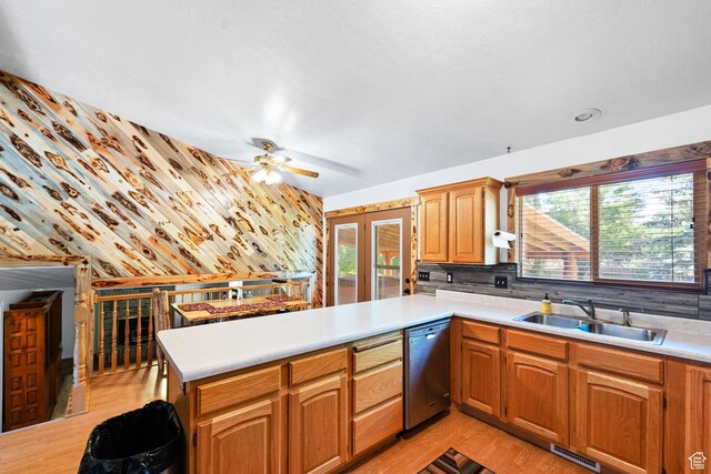 18509 Jefferson Ave, Eagle Mountain, UT 84013 - kitchen featuring a sink, stainless steel dishwasher, a peninsula, and light countertops