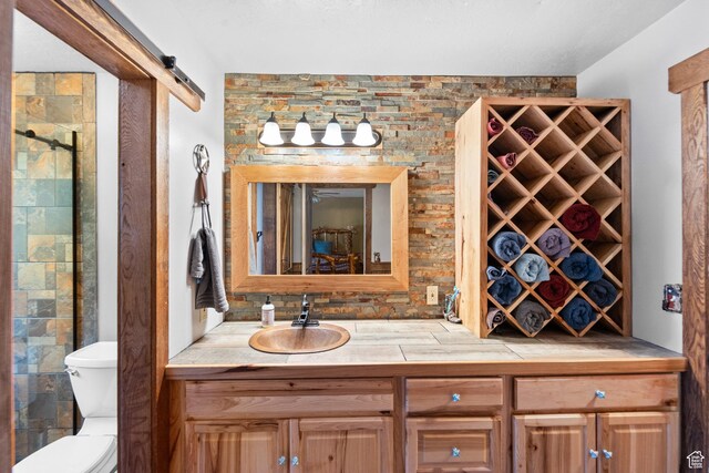 18509 Jefferson Ave, Eagle Mountain, UT 84013 - bathroom featuring toilet, vanity, and tiled shower