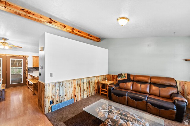18509 Jefferson Ave, Eagle Mountain, UT 84013 - living area featuring a wainscoted wall, light wood-style flooring, a ceiling fan, and wood walls