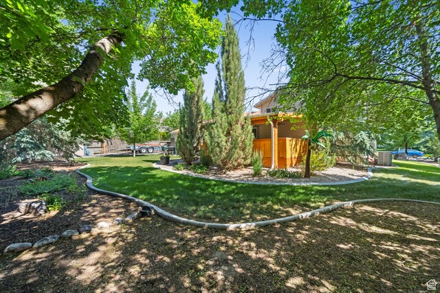 18509 Jefferson Ave, Eagle Mountain, UT 84013 - view of green lawn with central AC