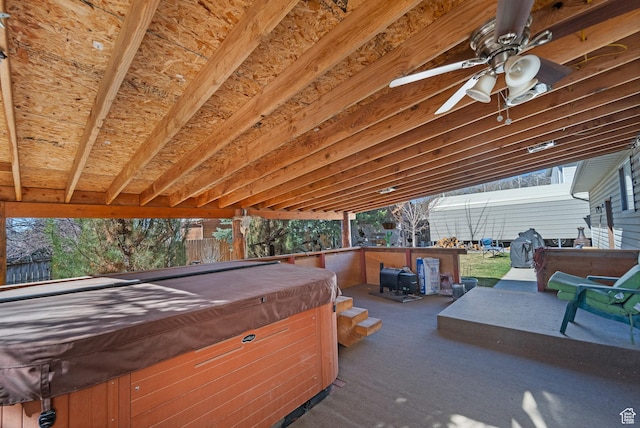 view of patio / terrace featuring ceiling fan and a hot tub