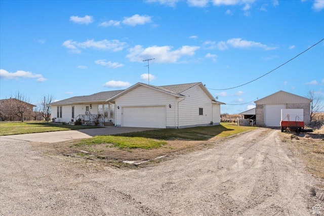 615 S 5900 W, Ogden, UT 84404 - view of front of property featuring a front yard, driveway, and a garage