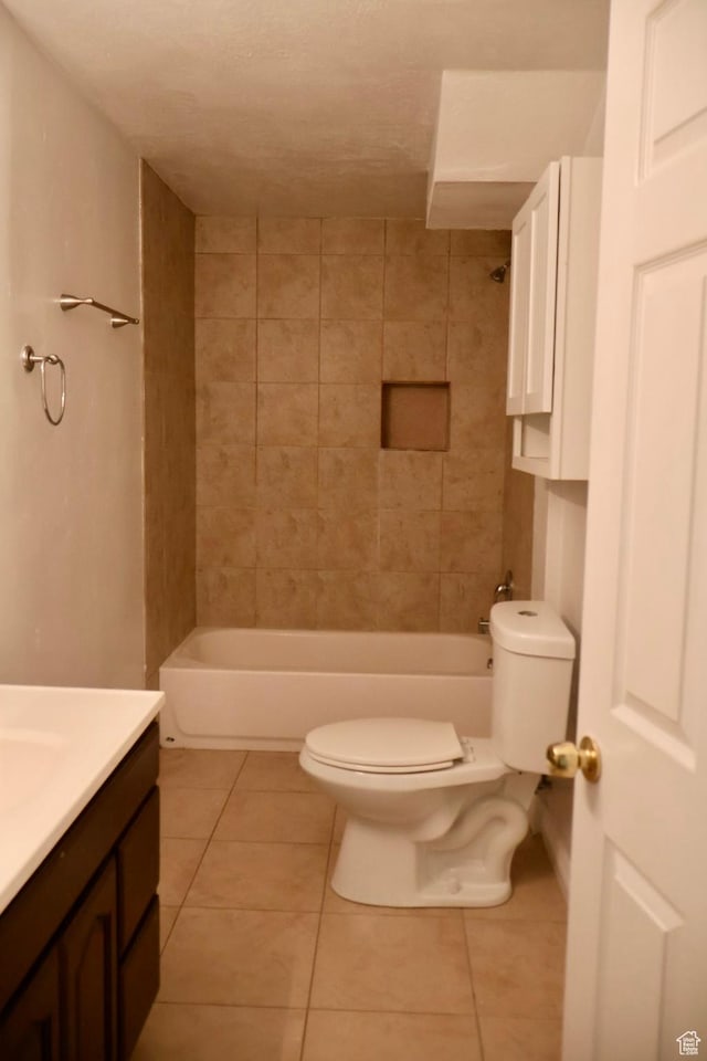 full bath with toilet, tile patterned floors, vanity, and tub / shower combination
