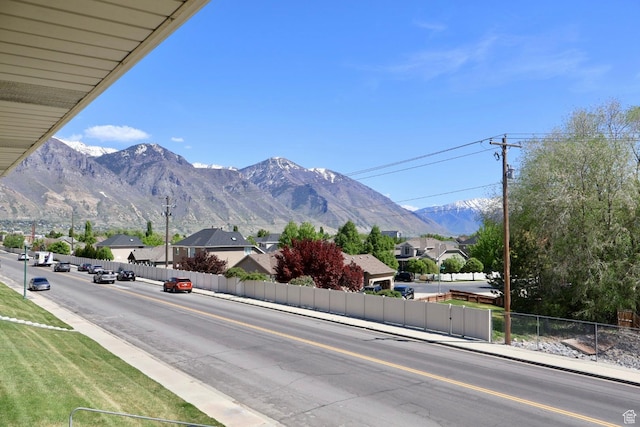 view of mountain background featuring nearby suburban area