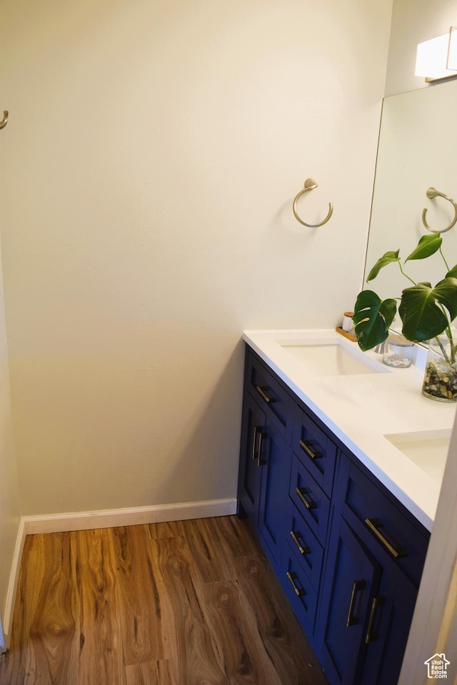 4759 S Pintail Ct, Salt Lake City, UT 84117 - full bath featuring wood finished floors, baseboards, and double vanity