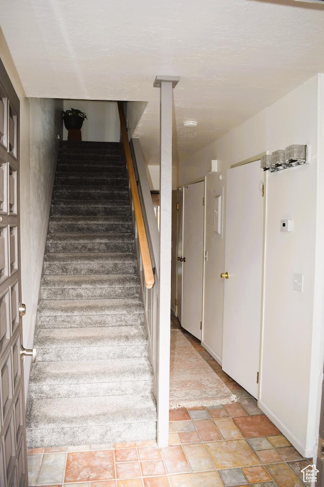4759 S Pintail Ct, Salt Lake City, UT 84117 - stairway featuring stone finish floors