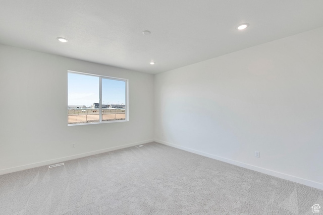 2156 S 4140 W Unit 69, Taylor, UT 84401 - spare room featuring visible vents, baseboards, recessed lighting, and light carpet