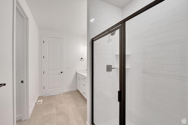 2156 S 4140 W Unit 69, Taylor, UT 84401 - bathroom featuring baseboards, a stall shower, tile patterned flooring, and vanity