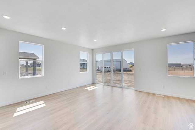 2156 S 4140 W Unit 69, Taylor, UT 84401 - spare room featuring visible vents, a healthy amount of sunlight, recessed lighting, and light wood finished floors