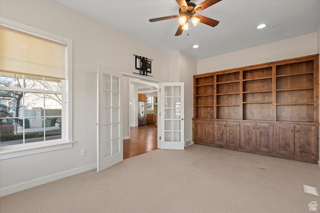 interior space with french doors, visible vents, baseboards, recessed lighting, and a ceiling fan