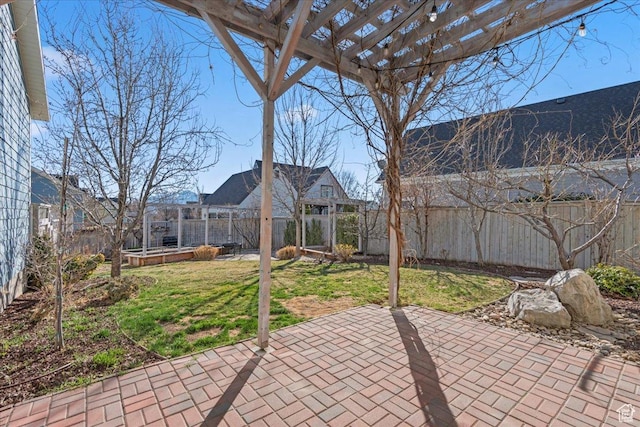 view of patio / terrace with a pergola and a fenced backyard