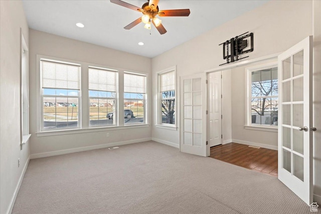 unfurnished room featuring recessed lighting, carpet, a ceiling fan, french doors, and baseboards