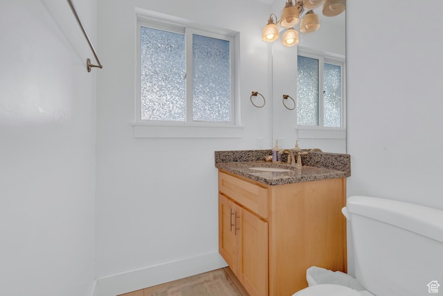 660 S Bear Lake Blvd, Garden City, UT 84028 - bathroom with toilet, vanity, and baseboards