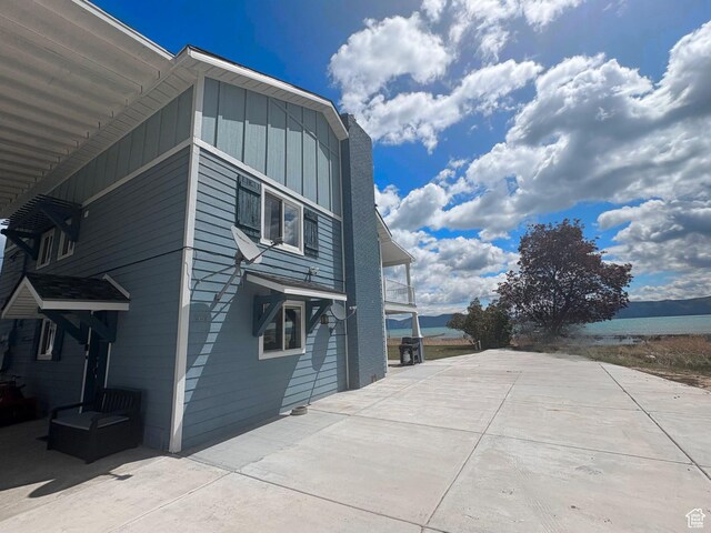 660 S Bear Lake Blvd, Garden City, UT 84028 - view of property exterior with board and batten siding and a water view