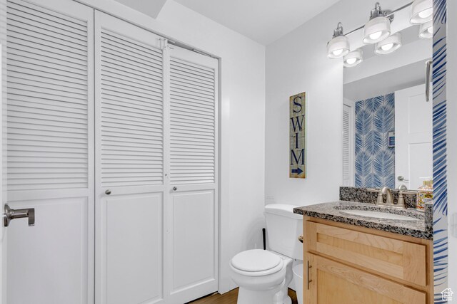 660 S Bear Lake Blvd, Garden City, UT 84028 - bathroom with a closet, toilet, and vanity