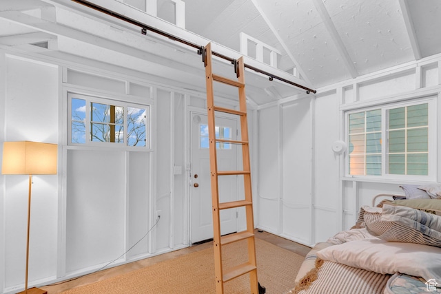 660 S Bear Lake Blvd, Garden City, UT 84028 - bedroom with lofted ceiling and a decorative wall