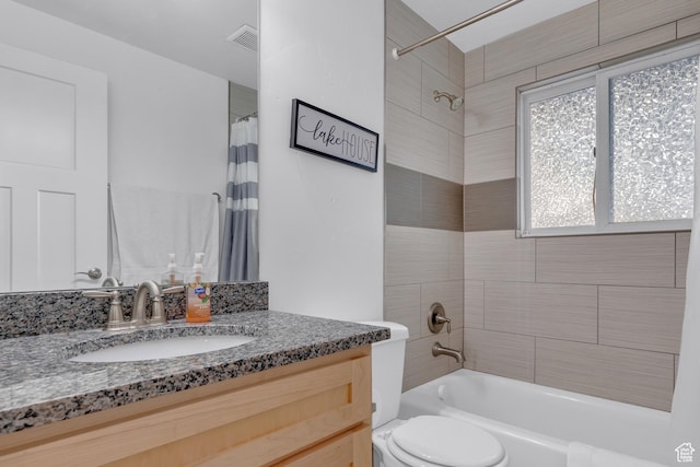 660 S Bear Lake Blvd, Garden City, UT 84028 - bathroom featuring shower / bath combo, toilet, and vanity