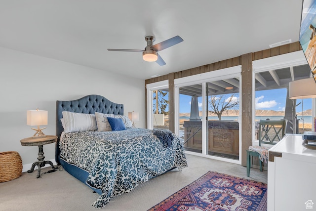 660 S Bear Lake Blvd, Garden City, UT 84028 - bedroom with access to exterior, carpet flooring, and ceiling fan