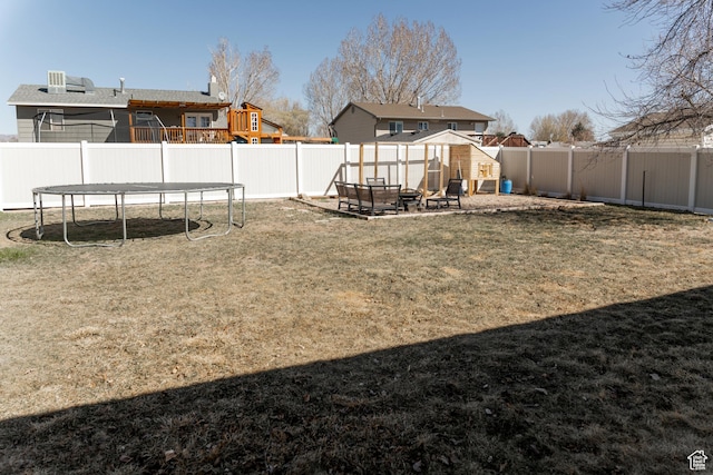 1348 W 200 S, Vernal, UT 84078 - view of yard featuring a fenced backyard, an outdoor fire pit, and a trampoline
