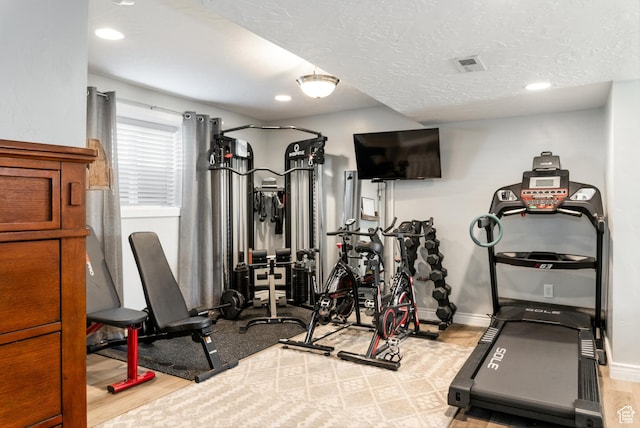 1348 W 200 S, Vernal, UT 84078 - workout room with recessed lighting, baseboards, a textured ceiling, visible vents, and wood finished floors