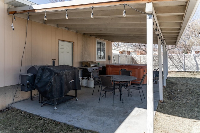 1348 W 200 S, Vernal, UT 84078 - view of patio / terrace featuring grilling area, outdoor dining space, fence, and a hot tub