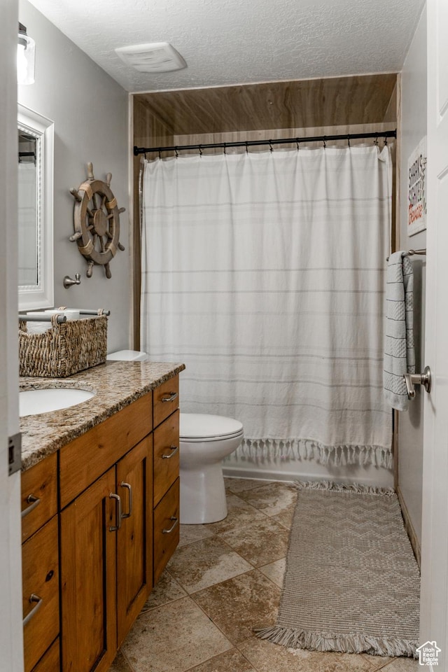 1348 W 200 S, Vernal, UT 84078 - full bathroom with a shower with curtain, toilet, vanity, and a textured ceiling