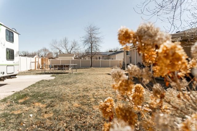 1348 W 200 S, Vernal, UT 84078 - view of yard with a trampoline, a fenced backyard, a residential view, and a patio