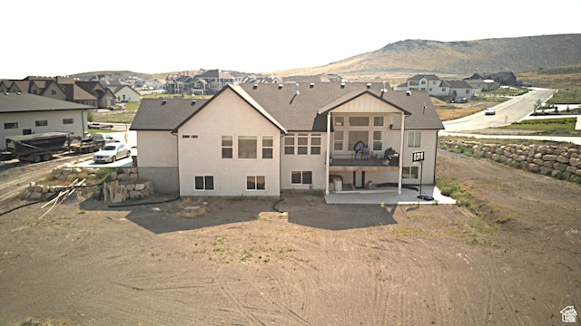 9940 N Vande Way, Eagle Mountain, UT 84005 - rear view of house with a residential view, stucco siding, a mountain view, and a patio