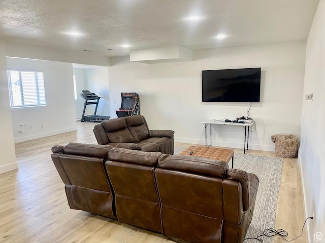 9940 N Vande Way, Eagle Mountain, UT 84005 - living room featuring baseboards, a textured ceiling, and wood finished floors