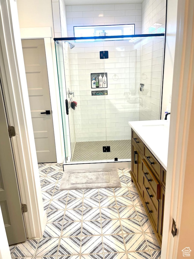 9940 N Vande Way, Eagle Mountain, UT 84005 - bathroom with a stall shower, tile patterned flooring, and vanity