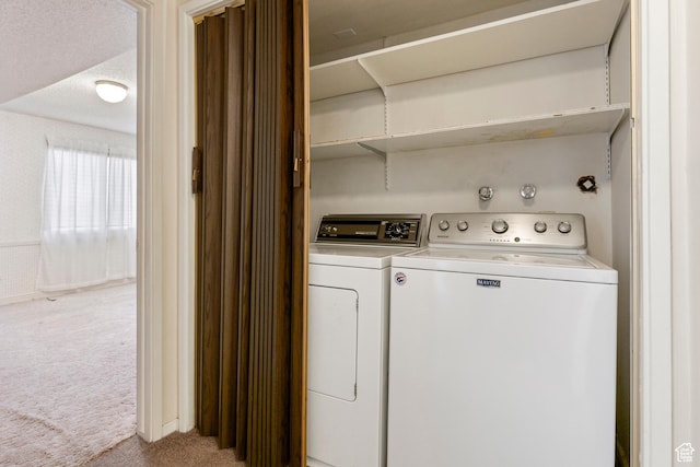laundry area featuring carpet, laundry area, and washing machine and dryer
