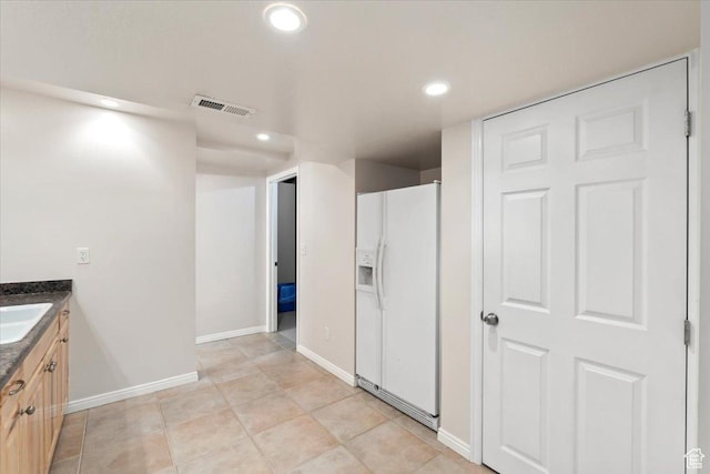 bathroom with tile patterned flooring, vanity, recessed lighting, baseboards, and visible vents