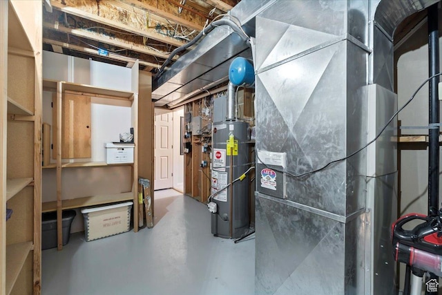 unfinished below grade area featuring heating unit and gas water heater