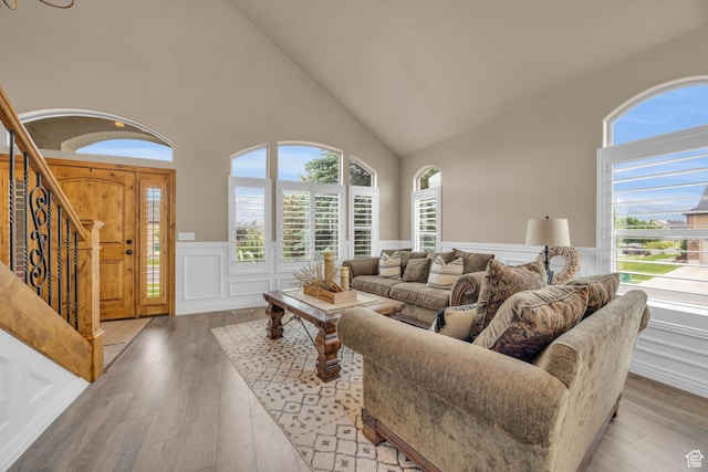 686 Wellington Dr, Kaysville, UT 84037 - living area with a wealth of natural light, wood finished floors, stairway, and wainscoting