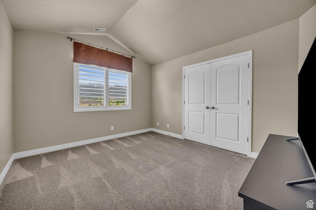 686 Wellington Dr, Kaysville, UT 84037 - unfurnished bedroom with baseboards, vaulted ceiling, a closet, and carpet flooring