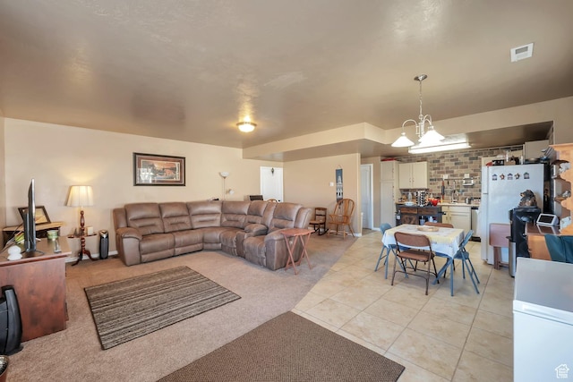 6092 W 13400 S, Herriman, UT 84096 - living room with a notable chandelier, light tile patterned floors, and visible vents