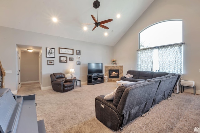 6092 W 13400 S, Herriman, UT 84096 - living area with high vaulted ceiling, light colored carpet, a ceiling fan, a tiled fireplace, and baseboards
