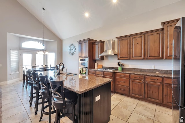 6092 W 13400 S, Herriman, UT 84096 - kitchen with wall chimney range hood, light tile patterned floors, a sink, and appliances with stainless steel finishes