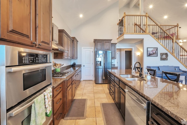 6092 W 13400 S, Herriman, UT 84096 - kitchen featuring wall chimney exhaust hood, a sink, appliances with stainless steel finishes, stone counters, and high vaulted ceiling