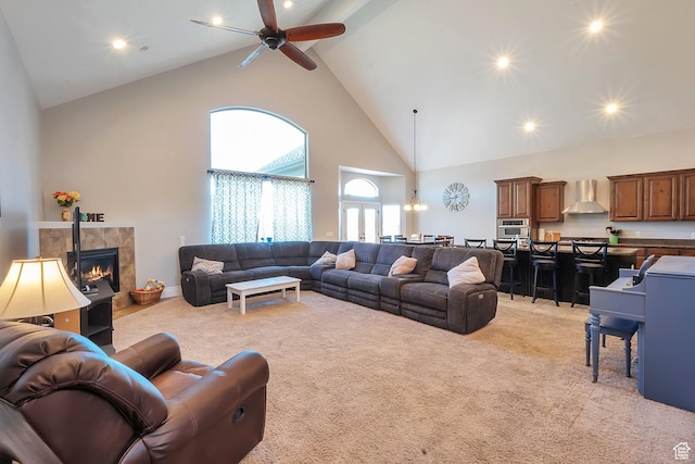 6092 W 13400 S, Herriman, UT 84096 - living room featuring high vaulted ceiling, a tile fireplace, light carpet, and a ceiling fan