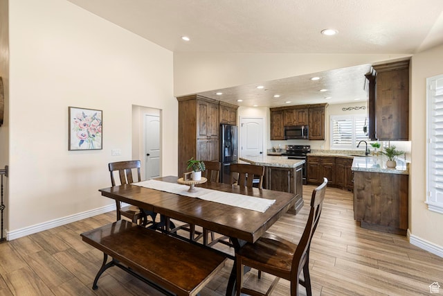 841 N Hale St Unit 1, Grantsville, UT 84029 - dining area featuring high vaulted ceiling, light wood finished floors, baseboards, and recessed lighting