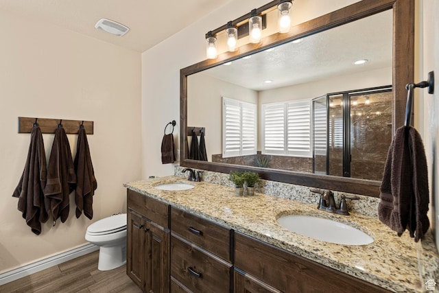 841 N Hale St Unit 1, Grantsville, UT 84029 - full bath with a sink, visible vents, toilet, and wood finished floors
