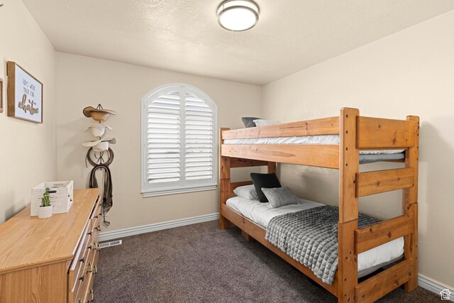 841 N Hale St Unit 1, Grantsville, UT 84029 - bedroom featuring dark carpet, baseboards, and visible vents