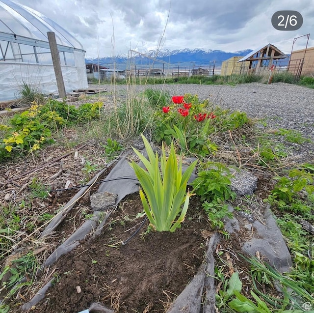 841 N Hale St Unit 1, Grantsville, UT 84029 - view of yard featuring a mountain view, fence, and an outdoor structure