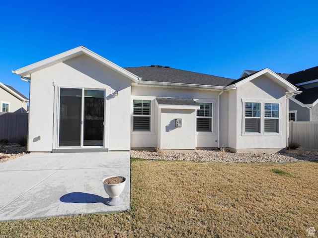 3631 W Cornstalk Way S, Riverton, UT 84065 - back of property featuring stucco siding, fence, a lawn, and a patio area