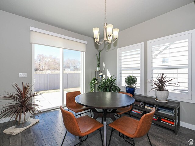 3631 W Cornstalk Way S, Riverton, UT 84065 - dining area featuring baseboards, a chandelier, and wood finished floors