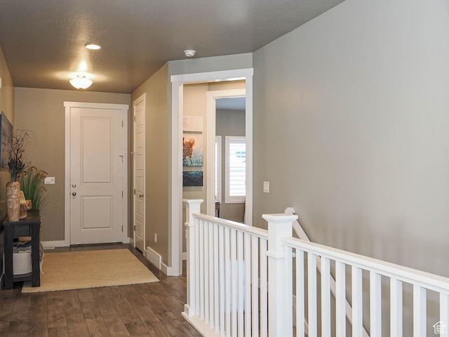 3631 W Cornstalk Way S, Riverton, UT 84065 - hallway with baseboards, an upstairs landing, and dark wood-style floors