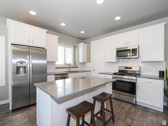 3631 W Cornstalk Way S, Riverton, UT 84065 - kitchen featuring white cabinetry, dark wood-style floors, a sink, and appliances with stainless steel finishes