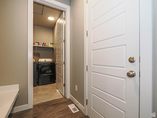 3631 W Cornstalk Way S, Riverton, UT 84065 - corridor with dark wood finished floors, baseboards, visible vents, and washing machine and clothes dryer